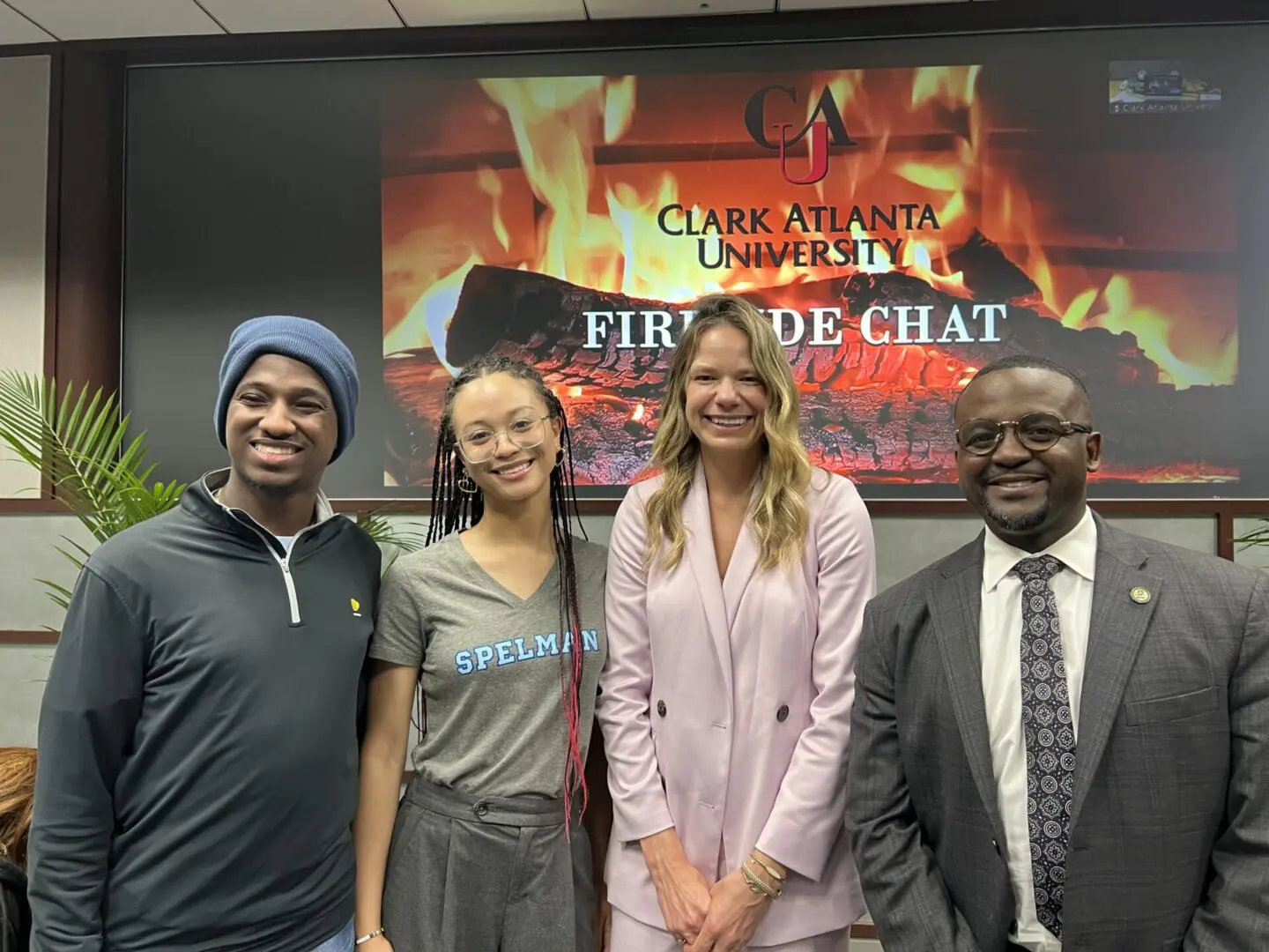 A group of people standing in front of a fire code chat sign.