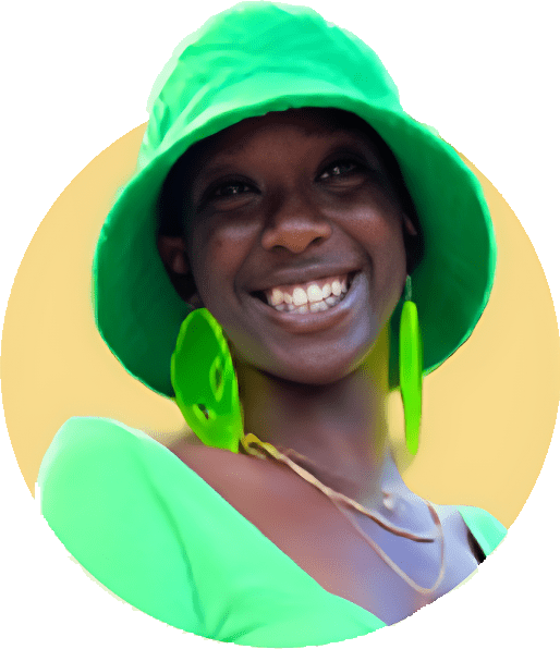 A woman wearing green hat and earrings smiling.